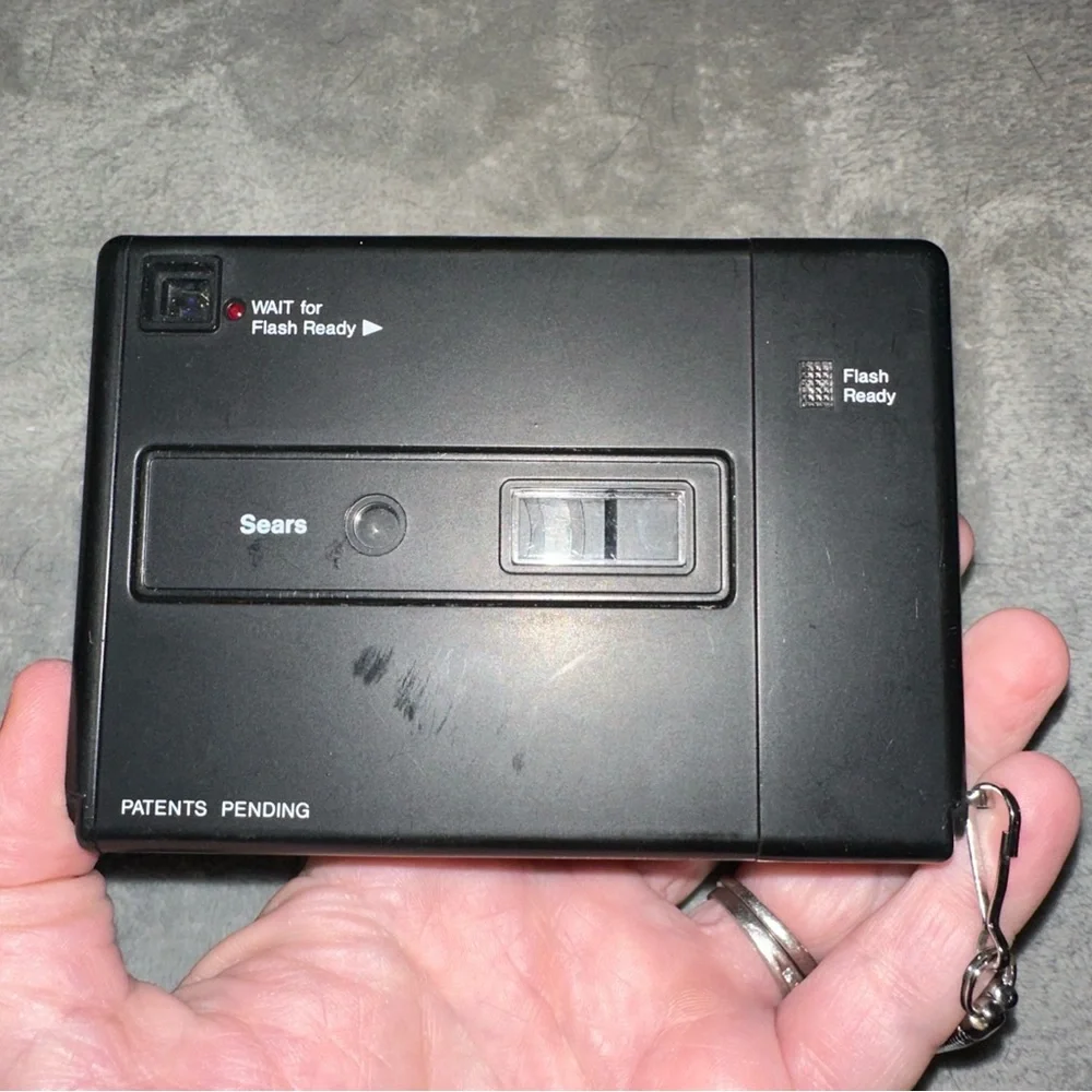 Sears Disc 770 Camera - Black and Silver‎